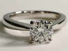 Diamond solitaire ring with thin band close to the central stone