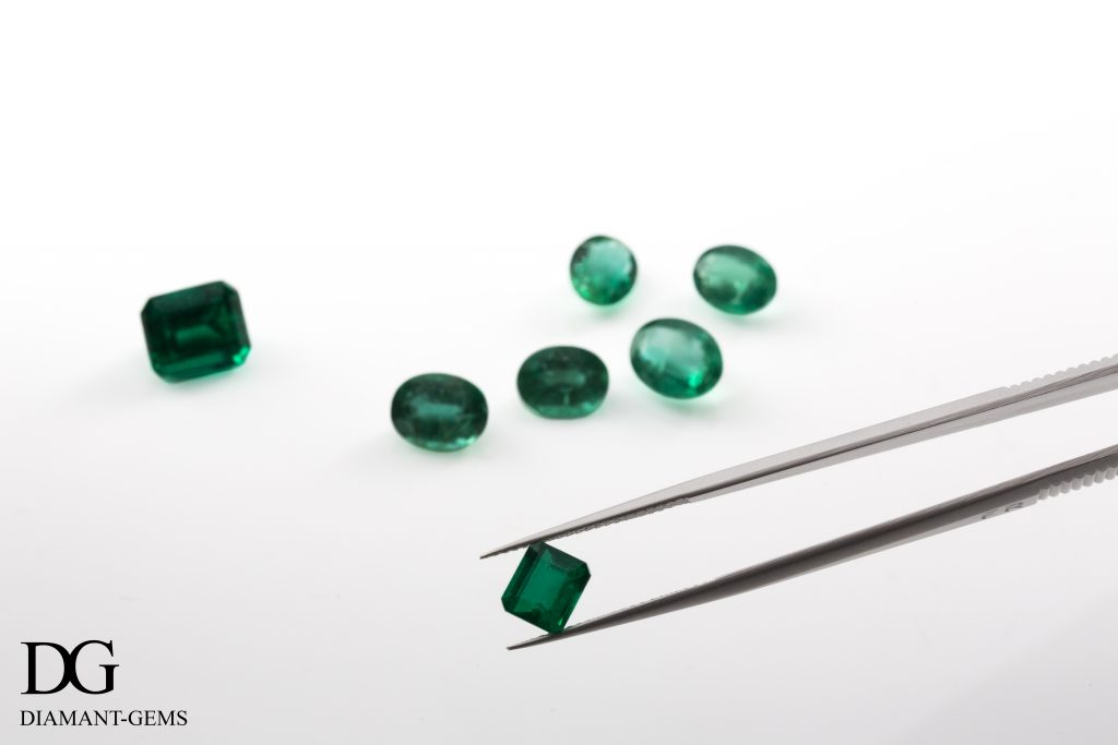 observation of an emerald held with pliers